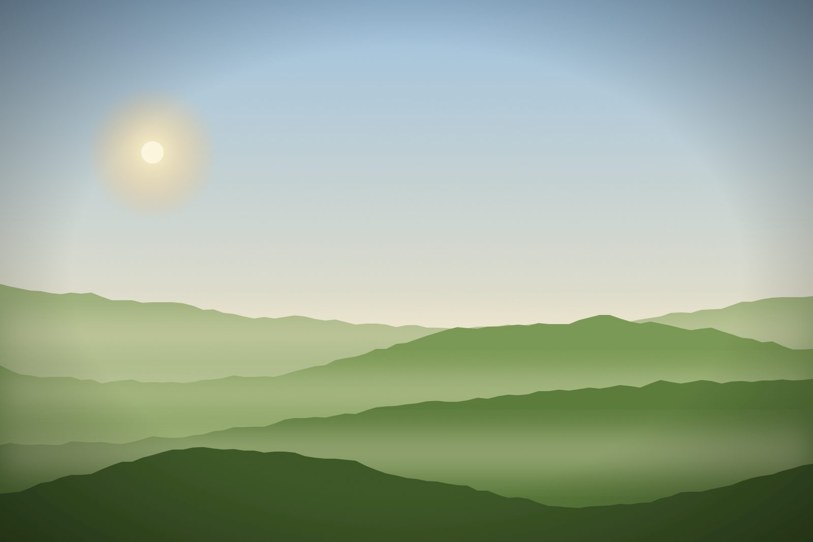 Rolling green hills in morning haze