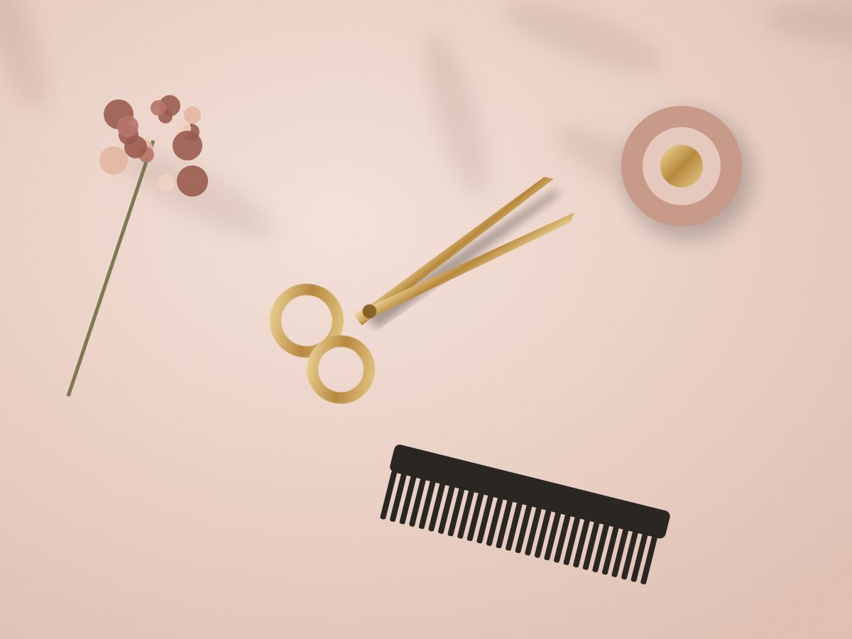 Gold shears, comb and dried flowers on a blush backdrop